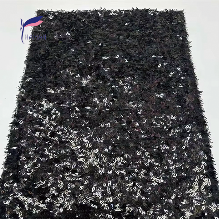 Triangular Laser Embroidery: Adds unique geometric detail for fashion-forward looks. Beaded Puff Embroidery: Enhances texture and volume for a luxurious feel. Sequin Embellishments: Sparkles and glitters for eye-catching glamour. 100% Acrylic Material: Provides durability and easy care for long-lasting wear. Abrasion-Resistant Finish: Ensures the fabric maintains its shape and appearance. - Image 4