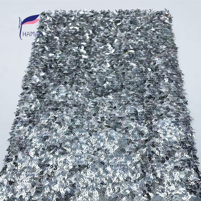 Triangular Laser Embroidery: Adds unique geometric detail for fashion-forward looks. Beaded Puff Embroidery: Enhances texture and volume for a luxurious feel. Sequin Embellishments: Sparkles and glitters for eye-catching glamour. 100% Acrylic Material: Provides durability and easy care for long-lasting wear. Abrasion-Resistant Finish: Ensures the fabric maintains its shape and appearance. - Image 5